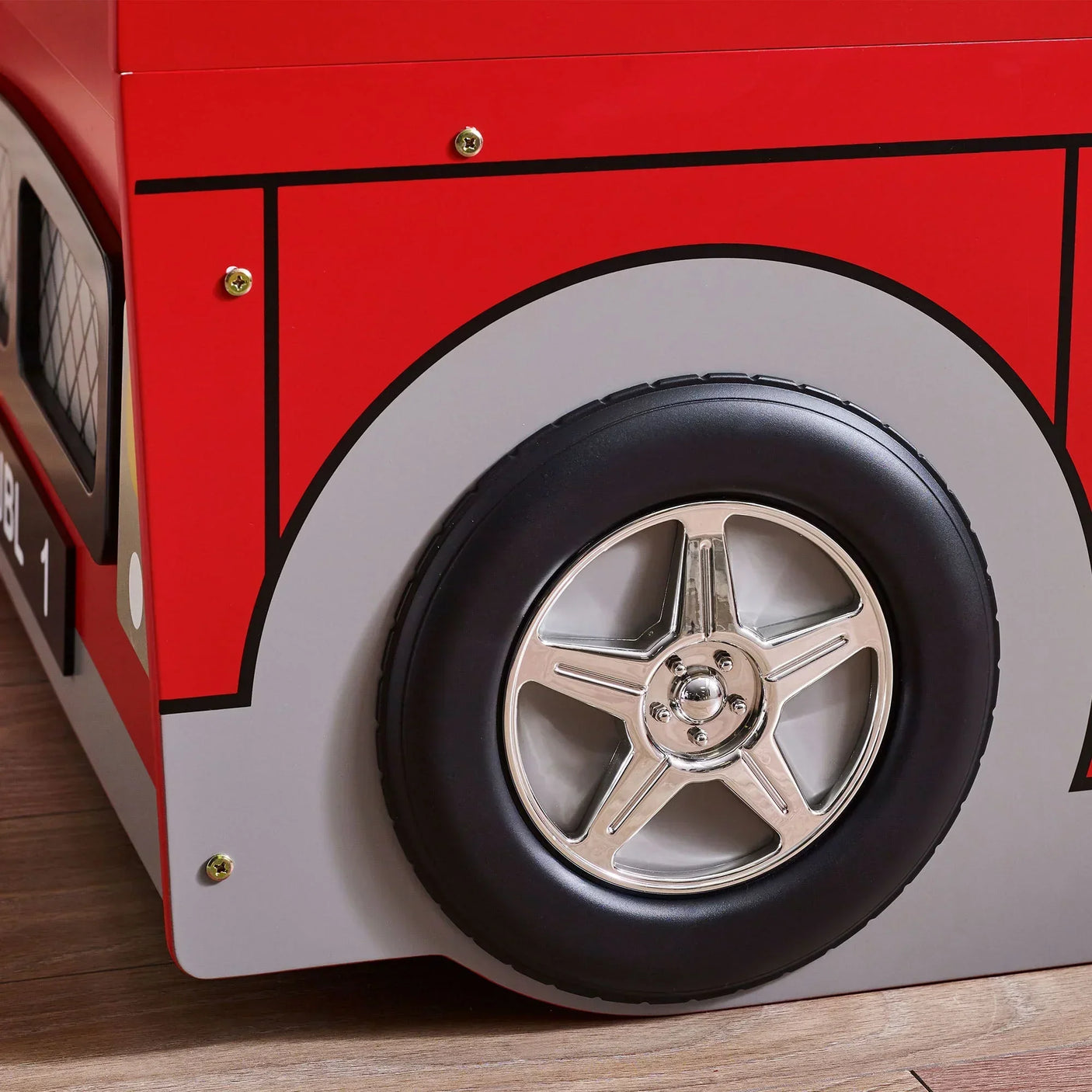 London bus bunk bed close-up showing chrome effect wheel and red frame detail