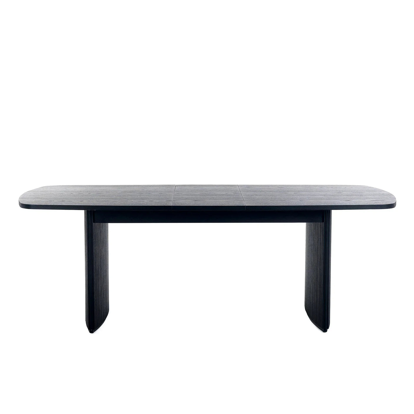 Black fluted extending dining table with rounded edges and panel legs, front view