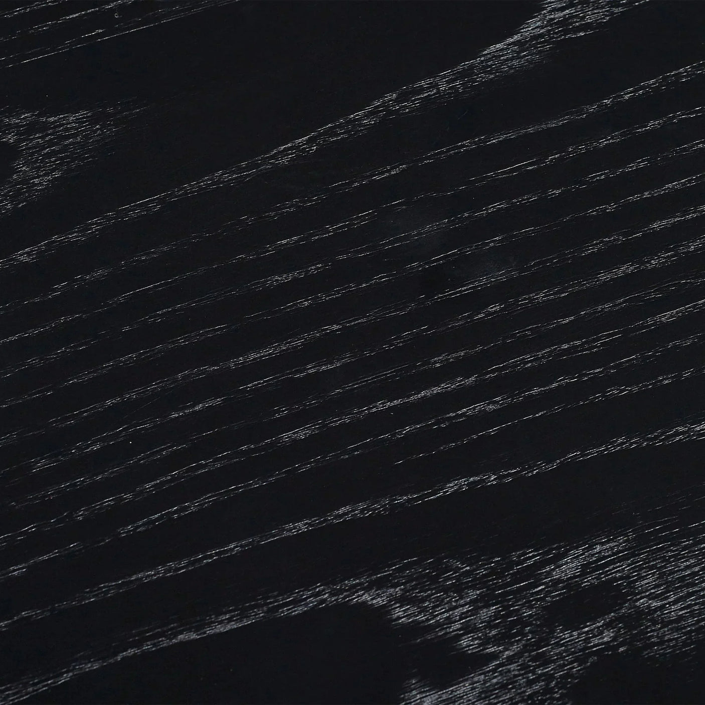Black fluted drinks table close-up showing wood grain texture detail