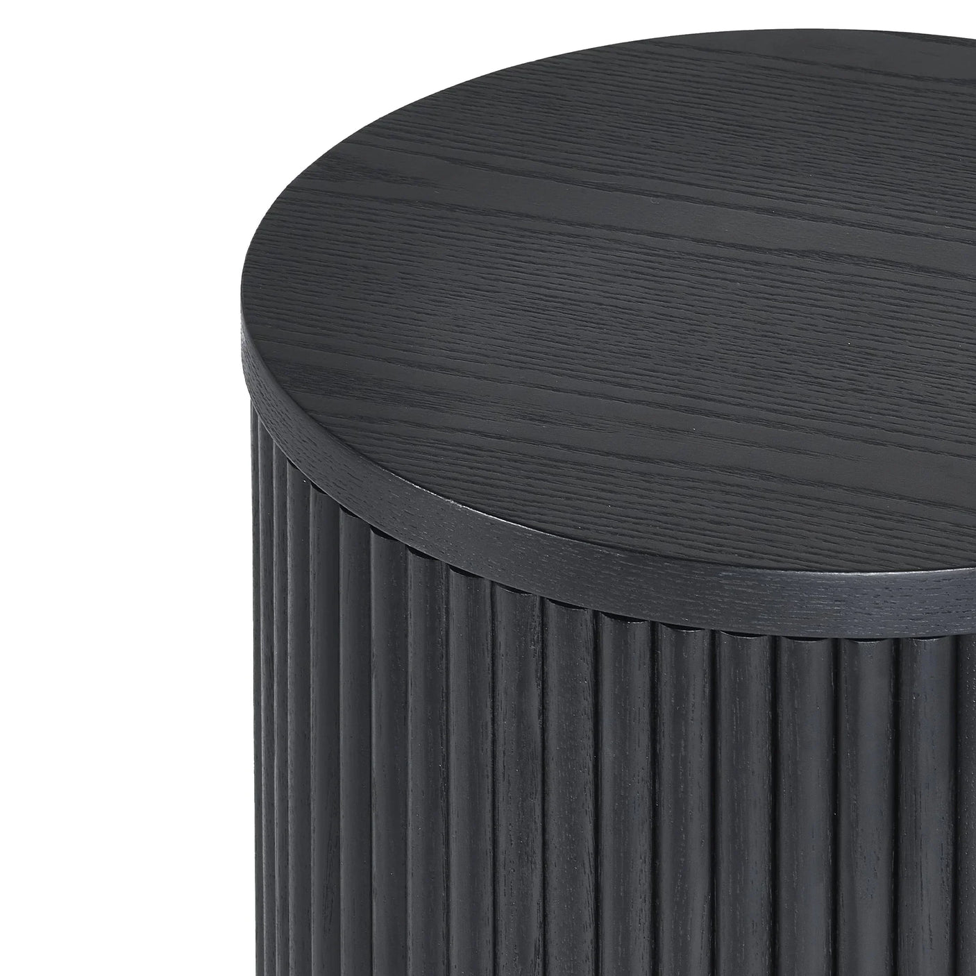 Black fluted side table with round wood grain top, close up of surface and vertical detailing