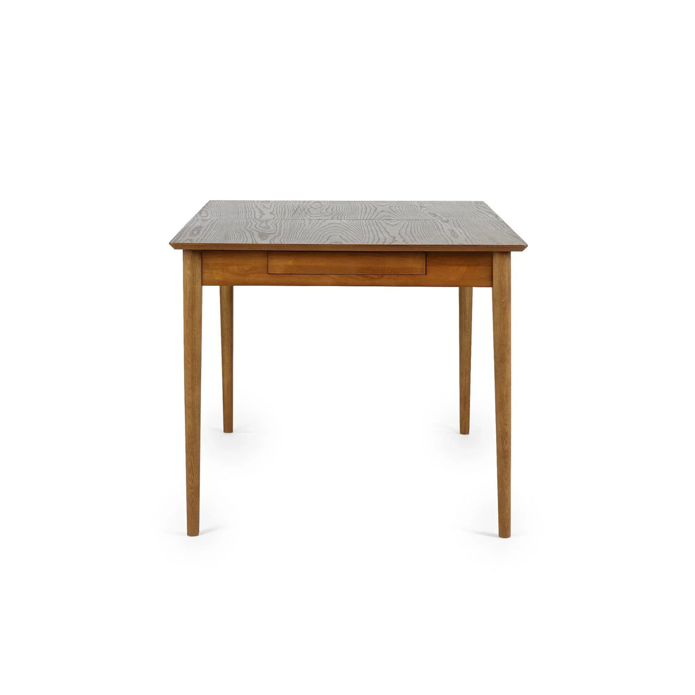 Rectangular wooden extending dining table with slim tapered legs, front view