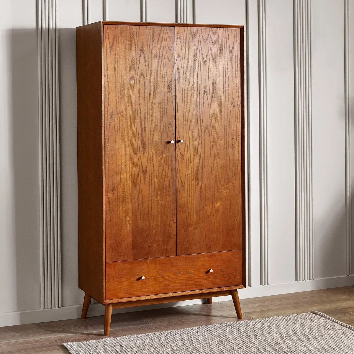 Wooden 2 door 1 drawer wardrobe with tapered legs in modern bedroom setting