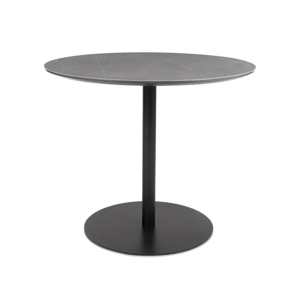 Round dining table with grey marble effect top and black pedestal base