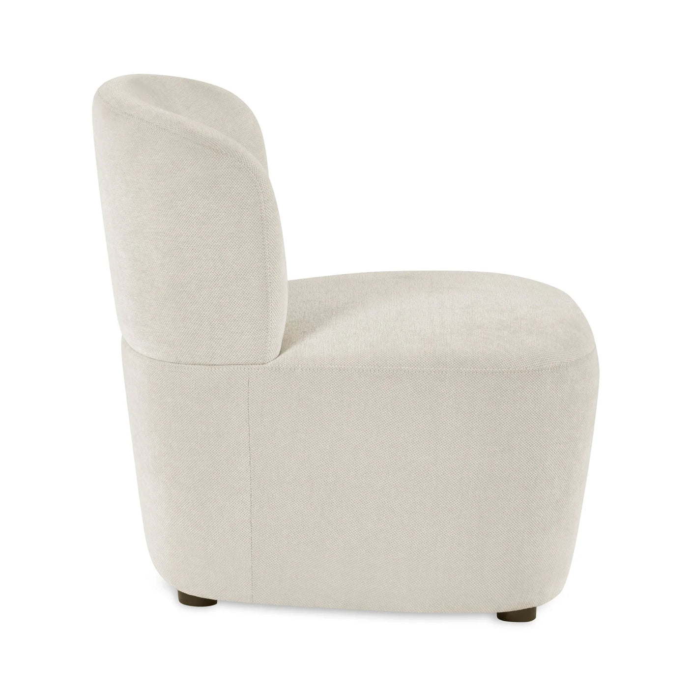 Side view of cream fabric accent chair with curved back and low wooden legs