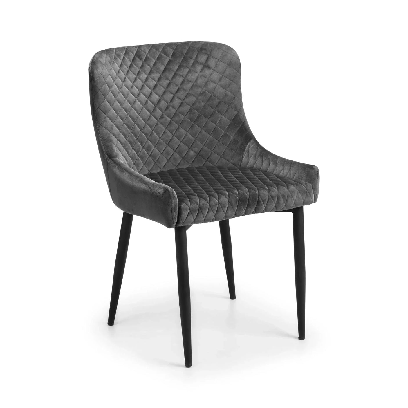 Grey velvet dining chair with quilted seat and black tapered legs, angled front view