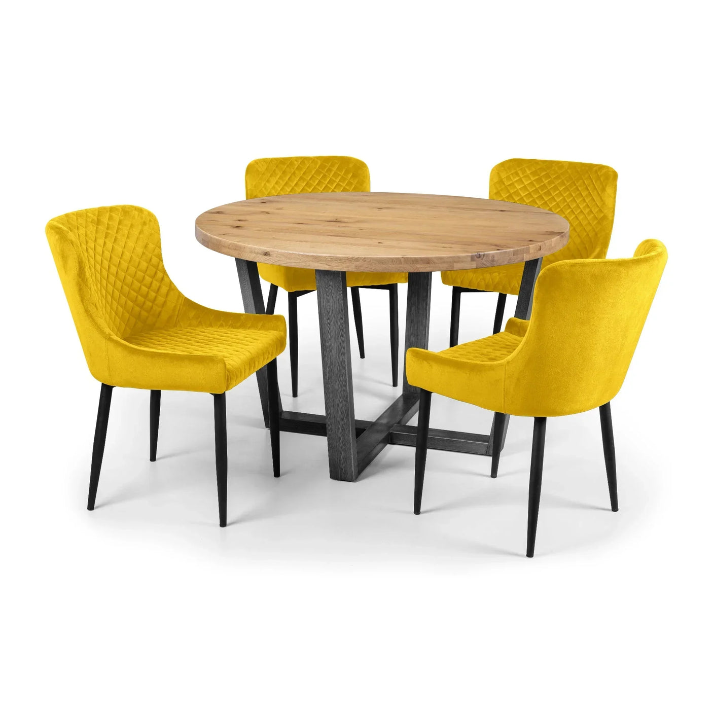 Round wood dining table with four mustard velvet dining chairs and black legs