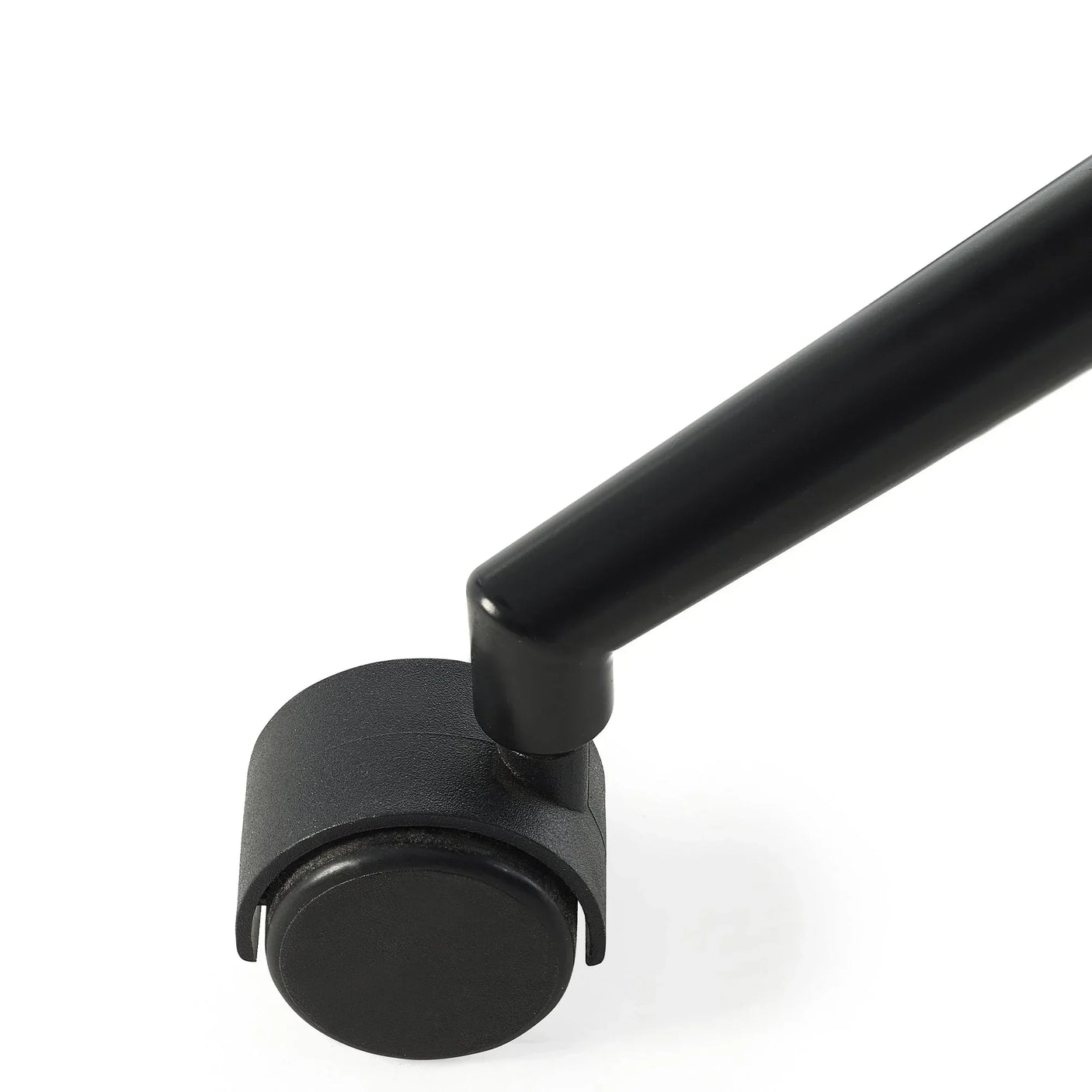 Close-up of black office chair caster wheel and metal leg on white surface