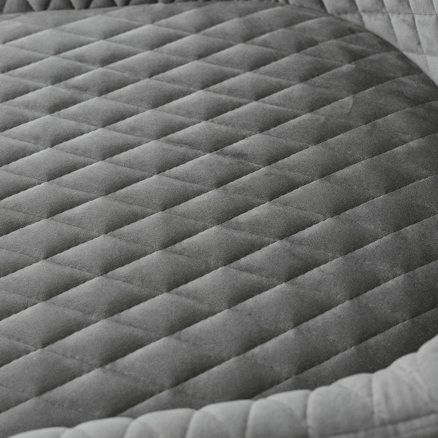 Grey velvet office chair seat with diamond quilted stitching detail