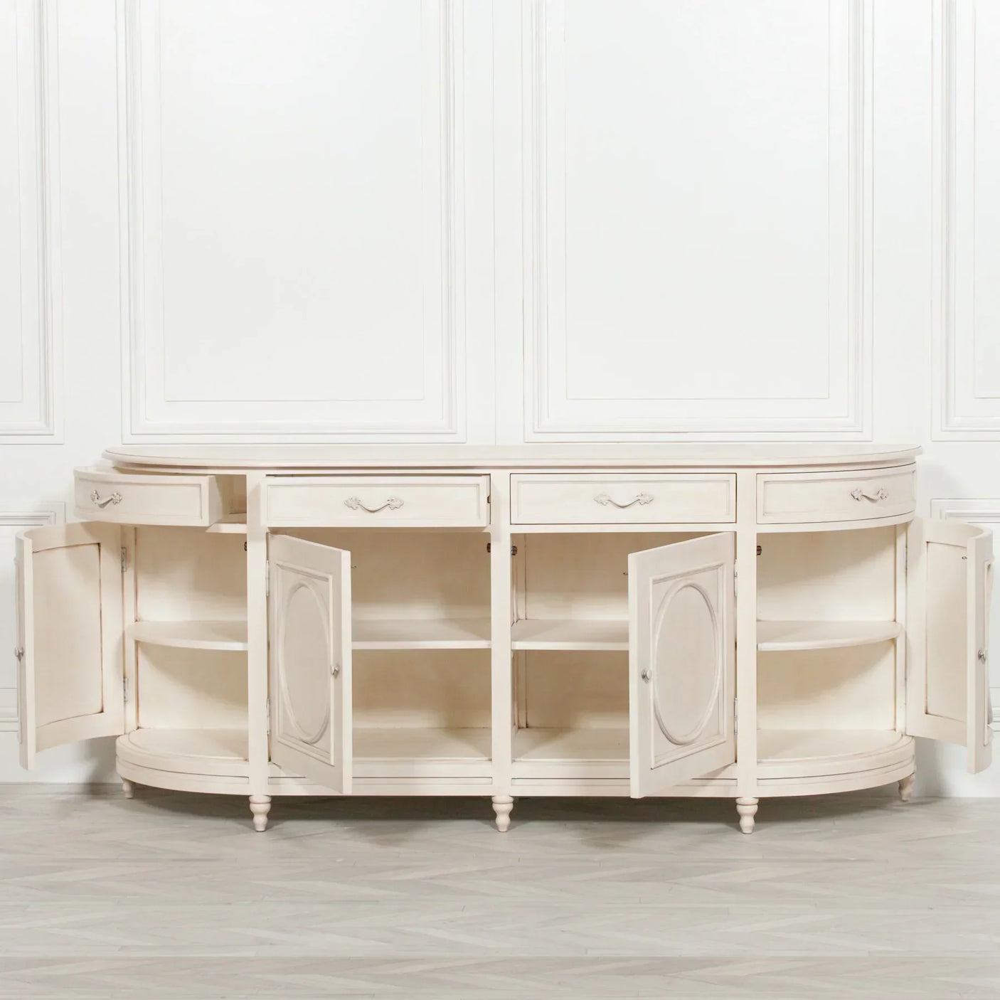 Cream sideboard with open storage cabinets and drawers, classic panelled design