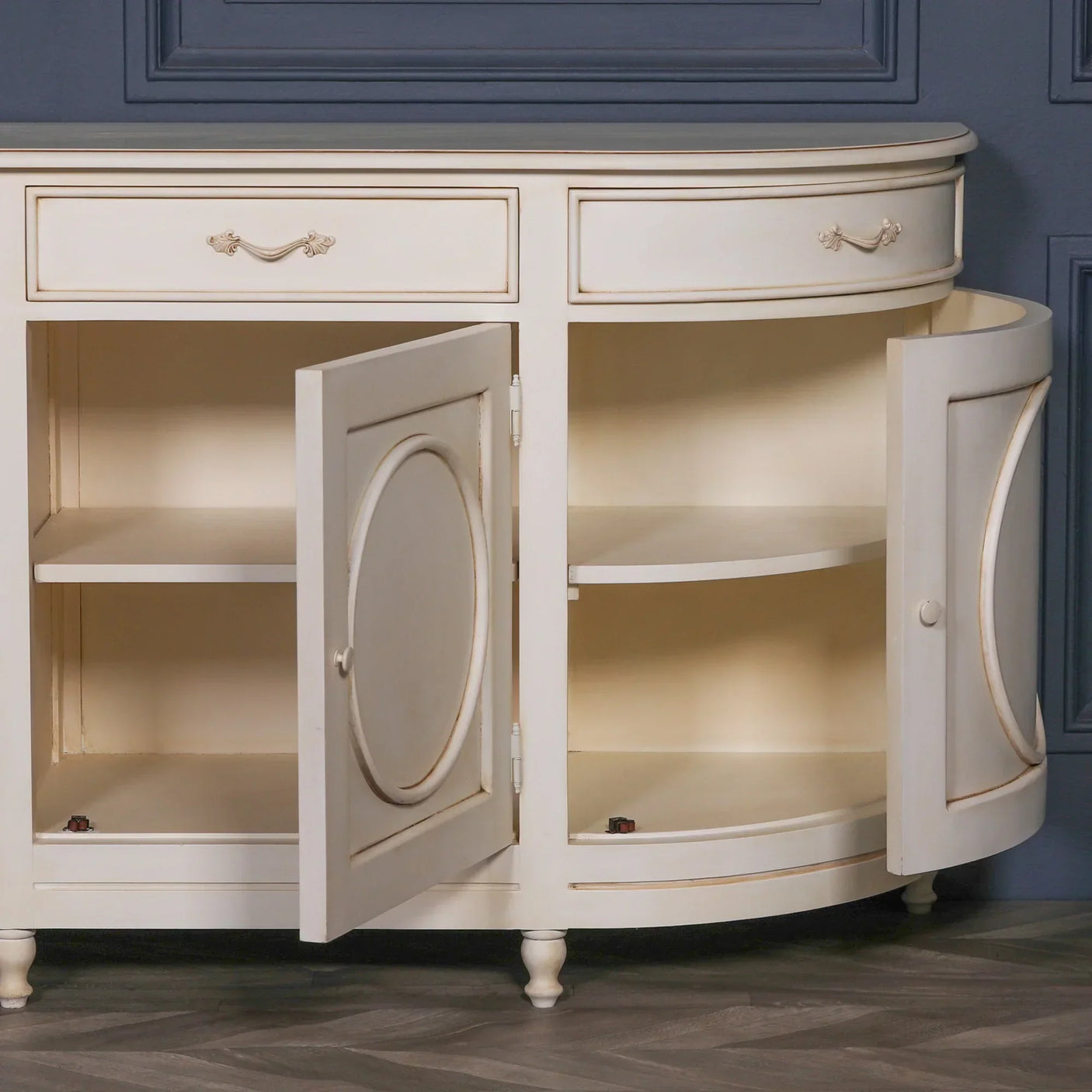 Cream painted sideboard cabinet with curved doors open showing interior shelving