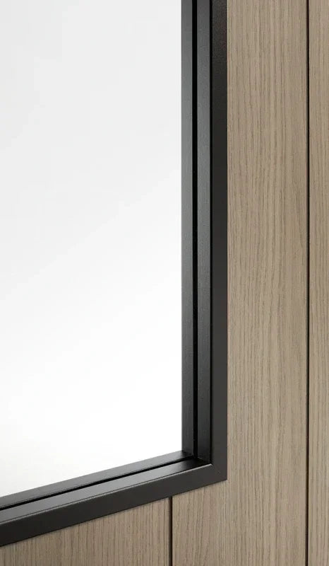 Light grey laminate door with glazed panel and black frame close-up