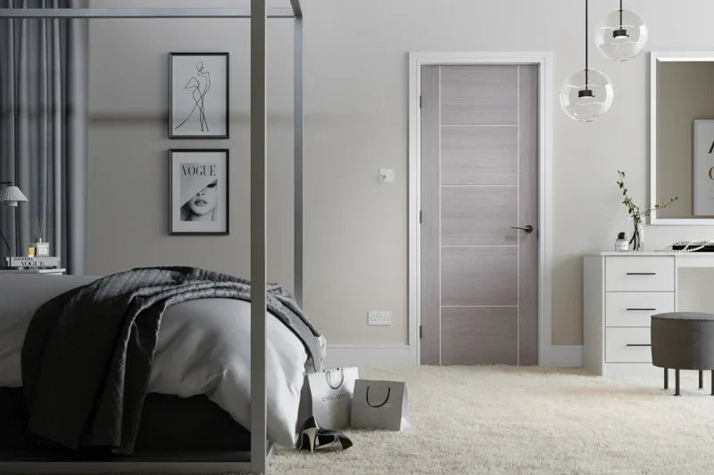 Light grey Vancouver 5 panel door in modern bedroom with white walls and chic decor