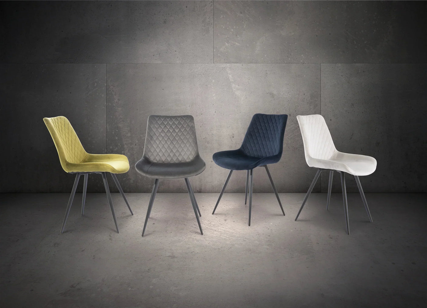 Modern dining chairs in yellow, grey, navy, and white velvet with quilted seats
