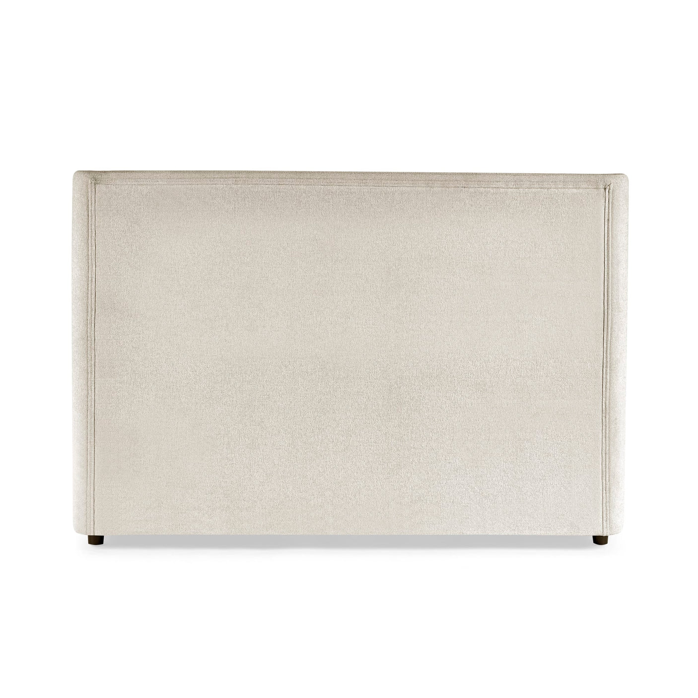 Beige upholstered headboard with simple stitched border and dark wooden feet on white background