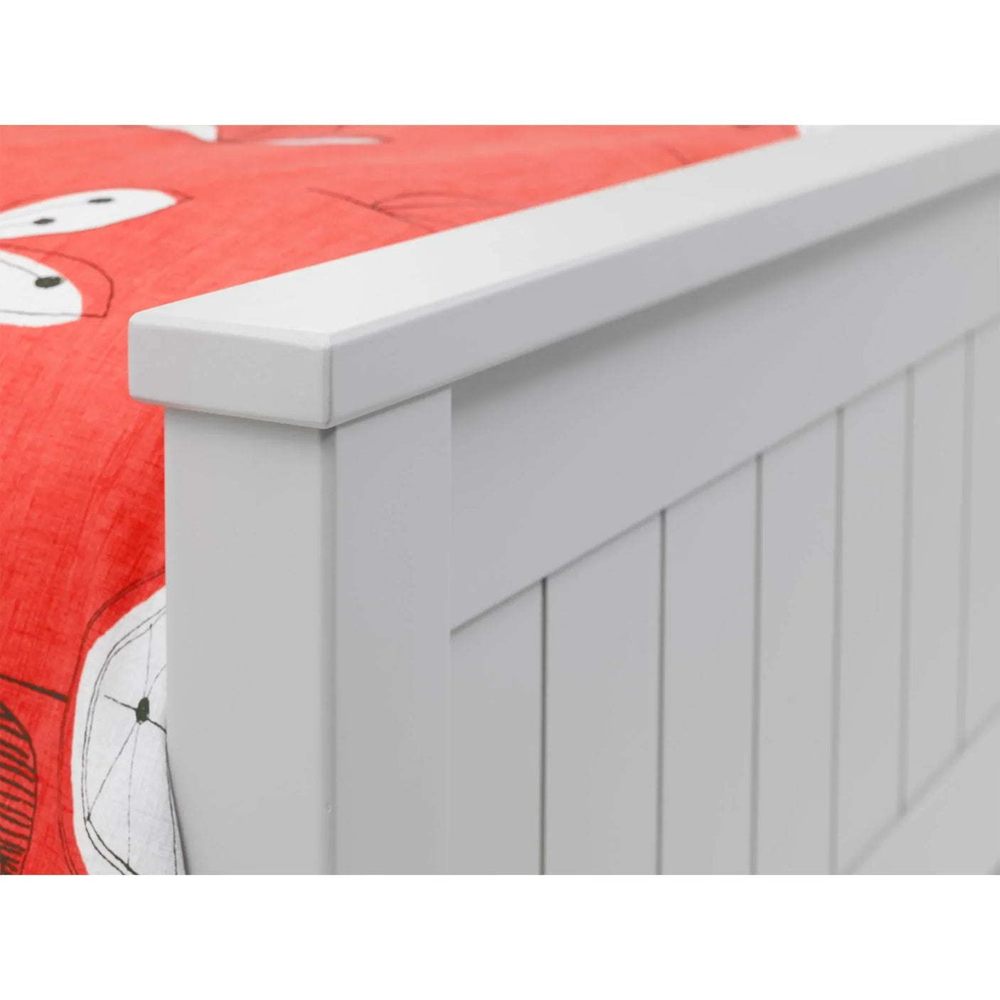 Grey bookcase bed panel detail with vertical grooves and red bedding corner