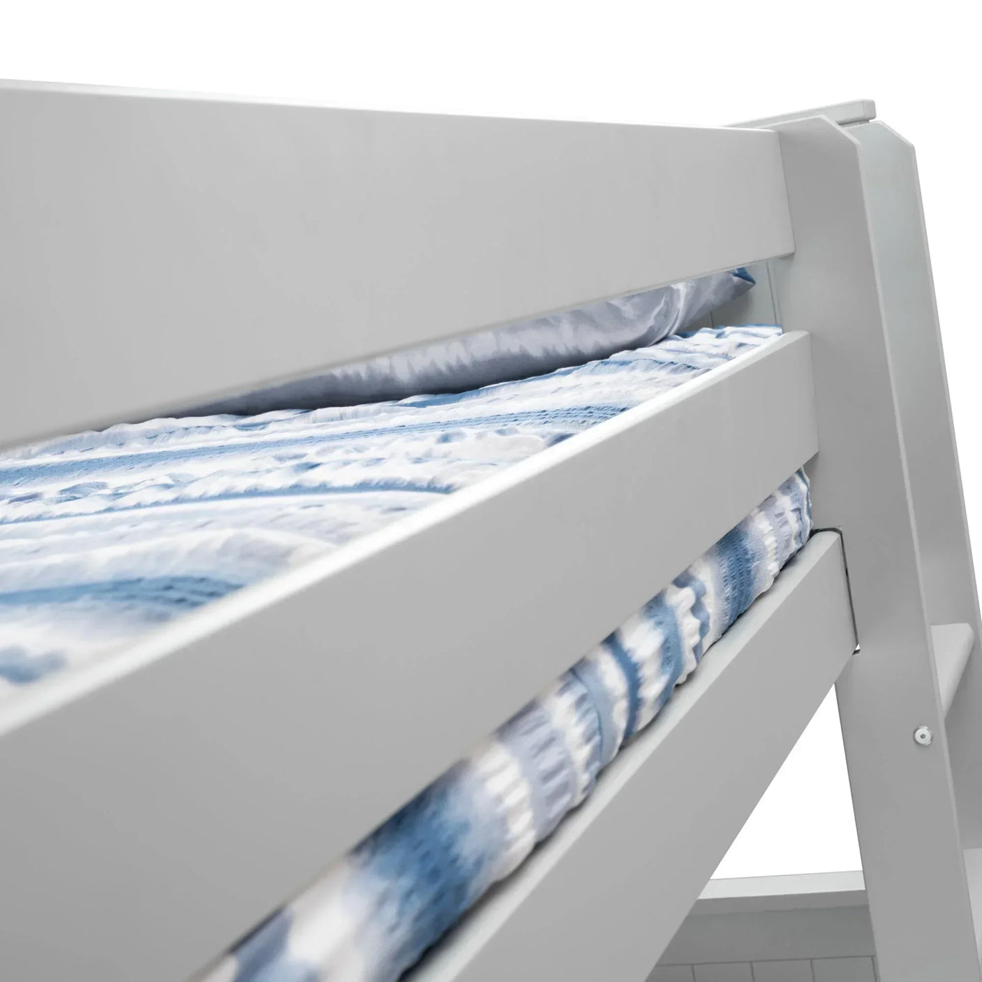 Dove grey bunk bed closeup showing side rails and blue patterned bedding
