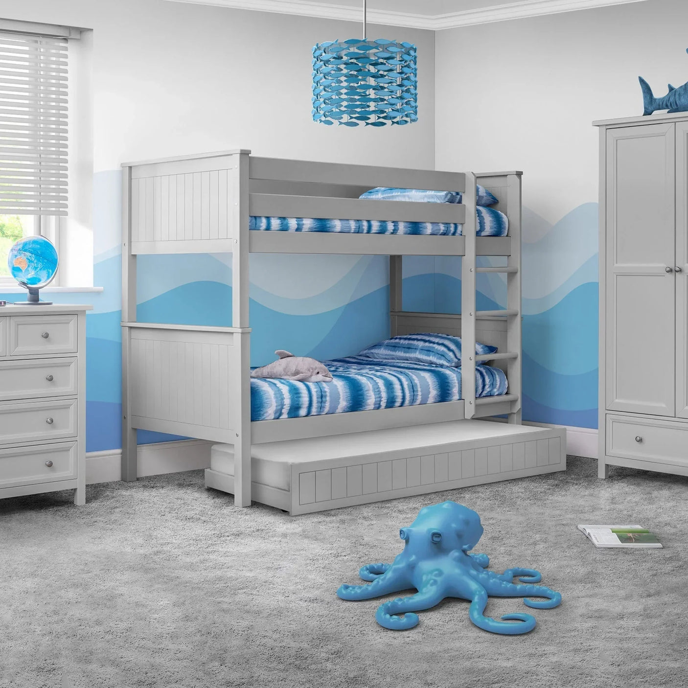 Maine bunk bed in dove grey with trundle in a blue wave themed children’s bedroom