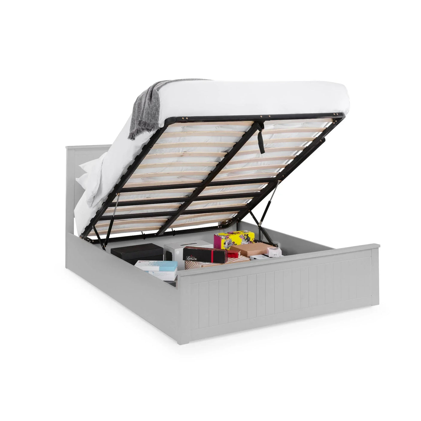 Grey ottoman storage bed with mattress lifted to show underbed storage space and boxes