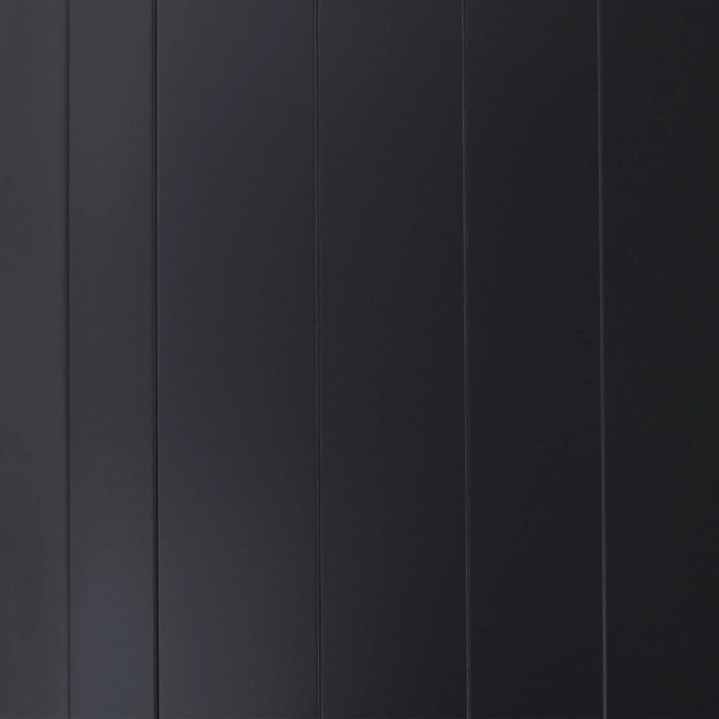 Anthracite wardrobe panel detail with vertical grooves and smooth finish