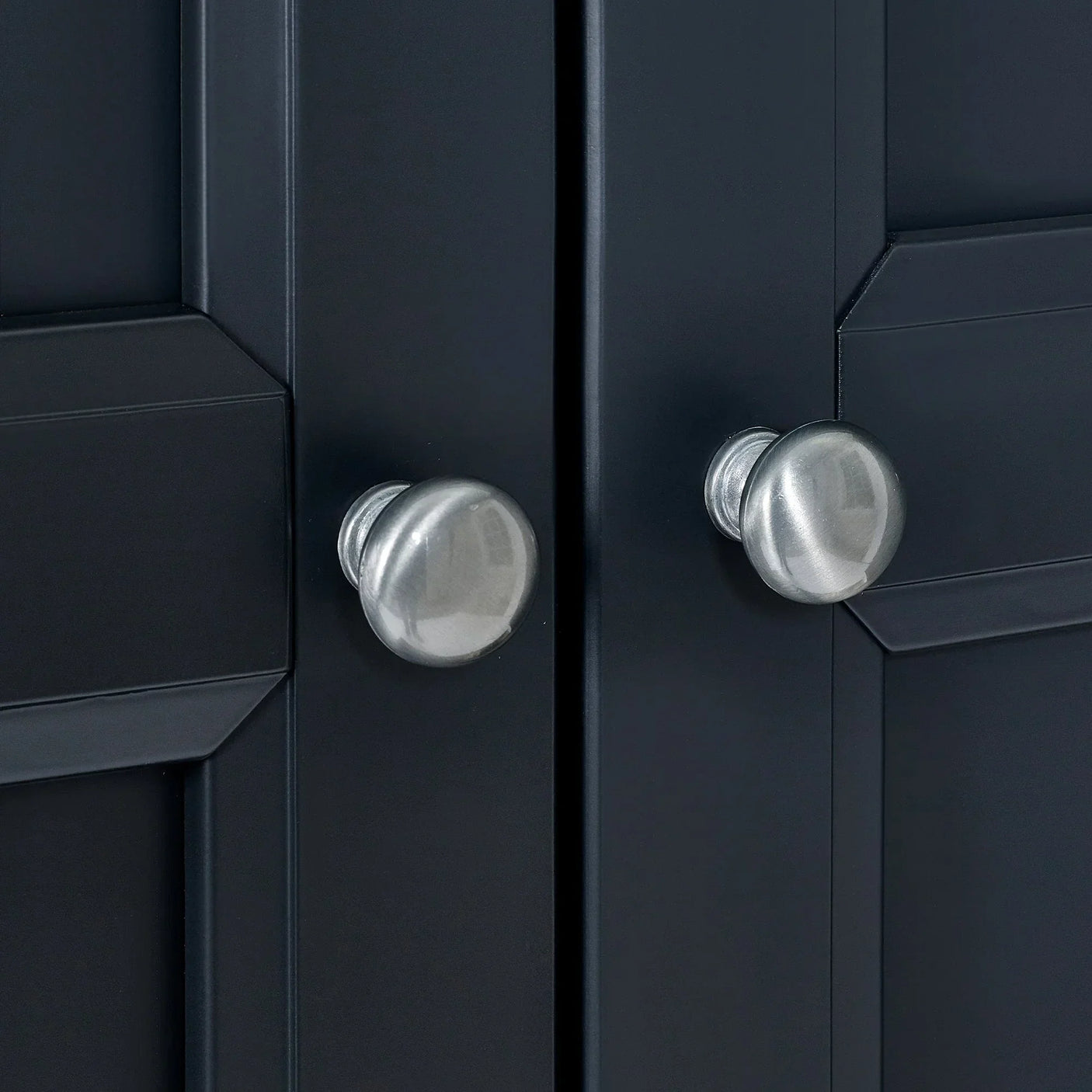 Anthracite wardrobe close-up showing brushed metal door handles and panel detailing
