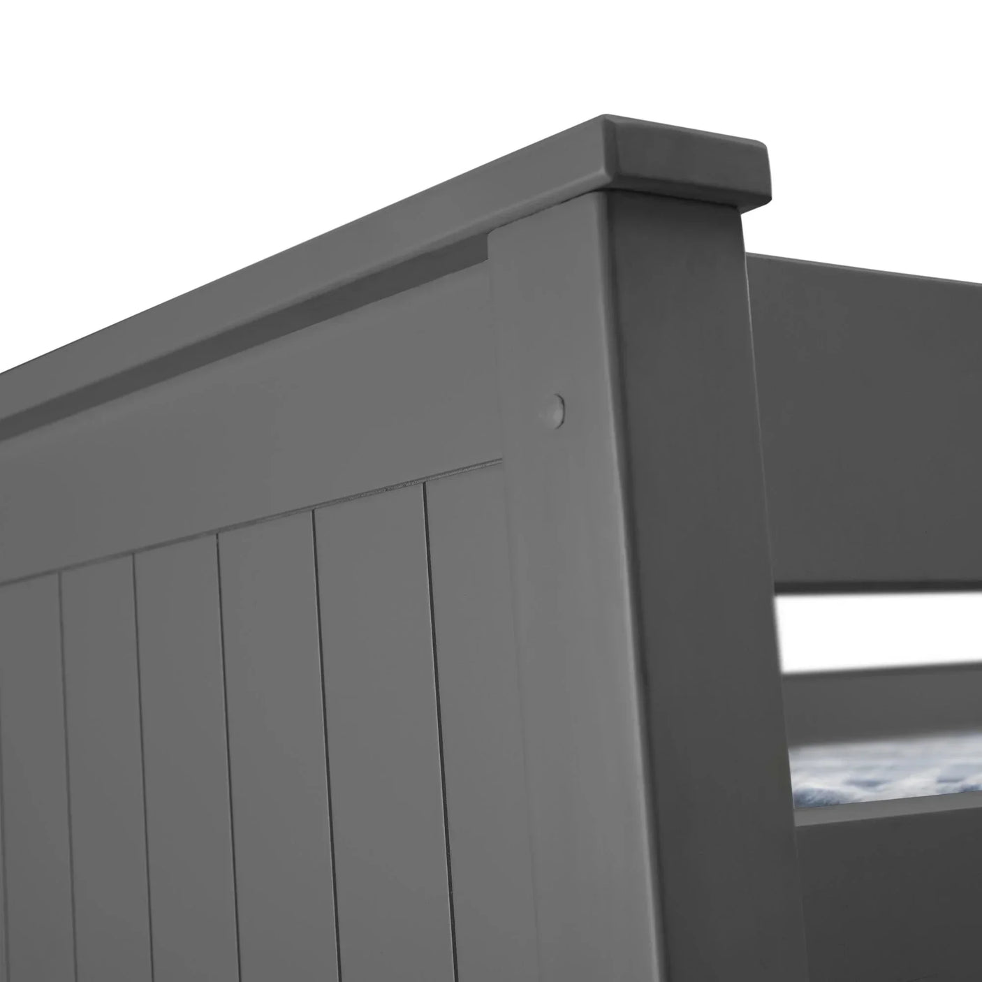 Grey wooden bunk bed corner with vertical panel detail and mattress edge visible