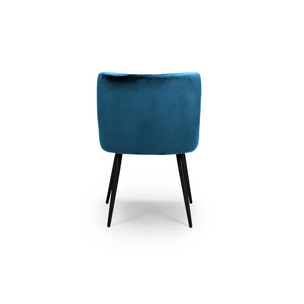 Blue velvet dining chair with metal legs, rear view on white background