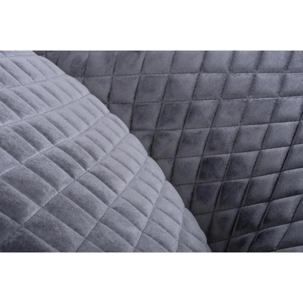 Close-up of grey quilted fabric sofa upholstery with square stitching detail