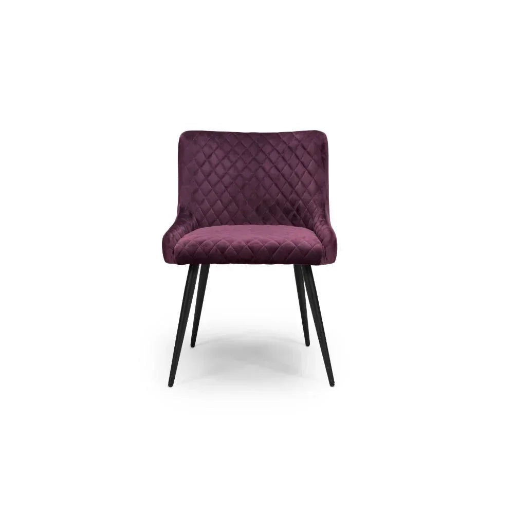 Plum velvet dining chair with quilted backrest and black metal legs, front view