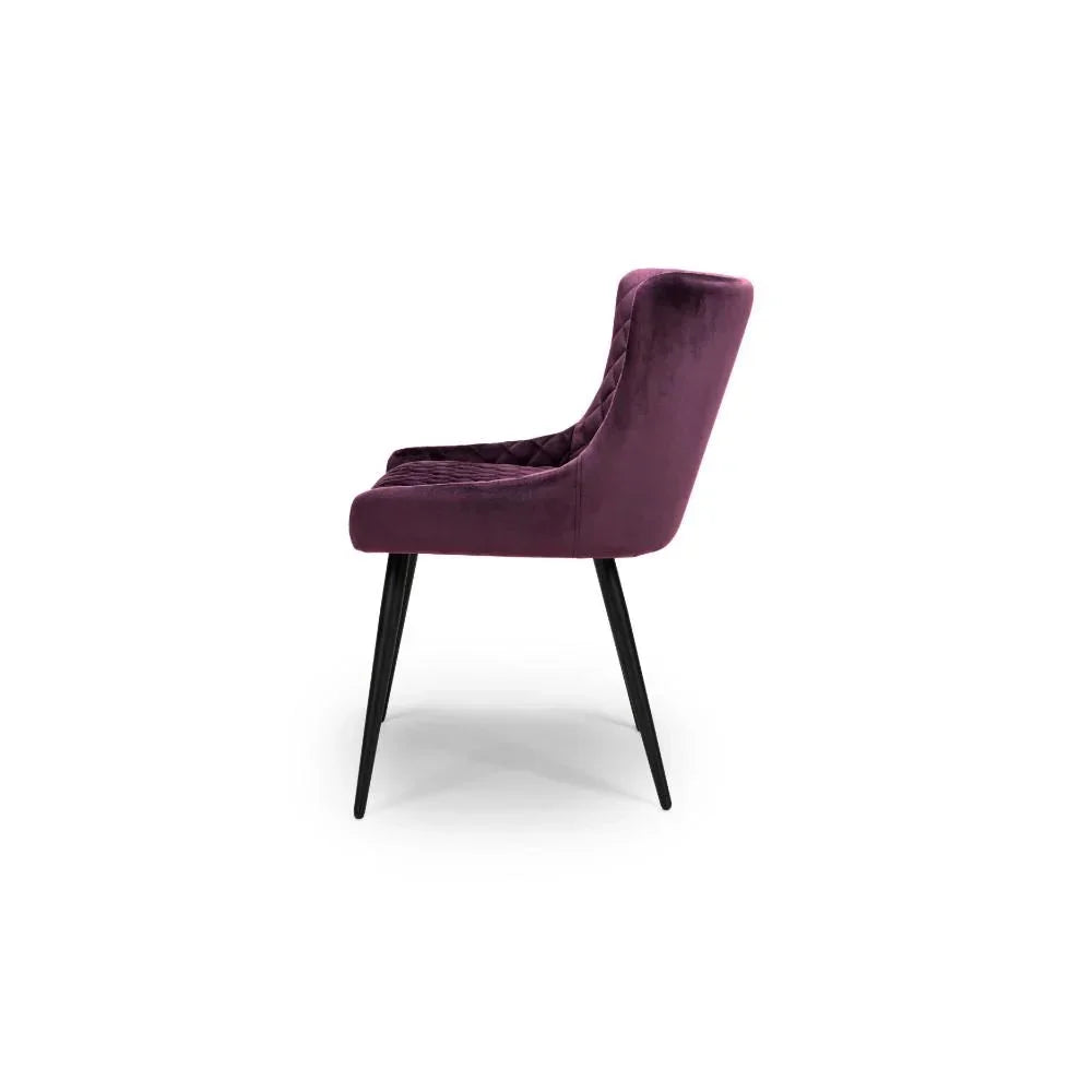 Purple velvet dining chair with black metal legs, side profile view