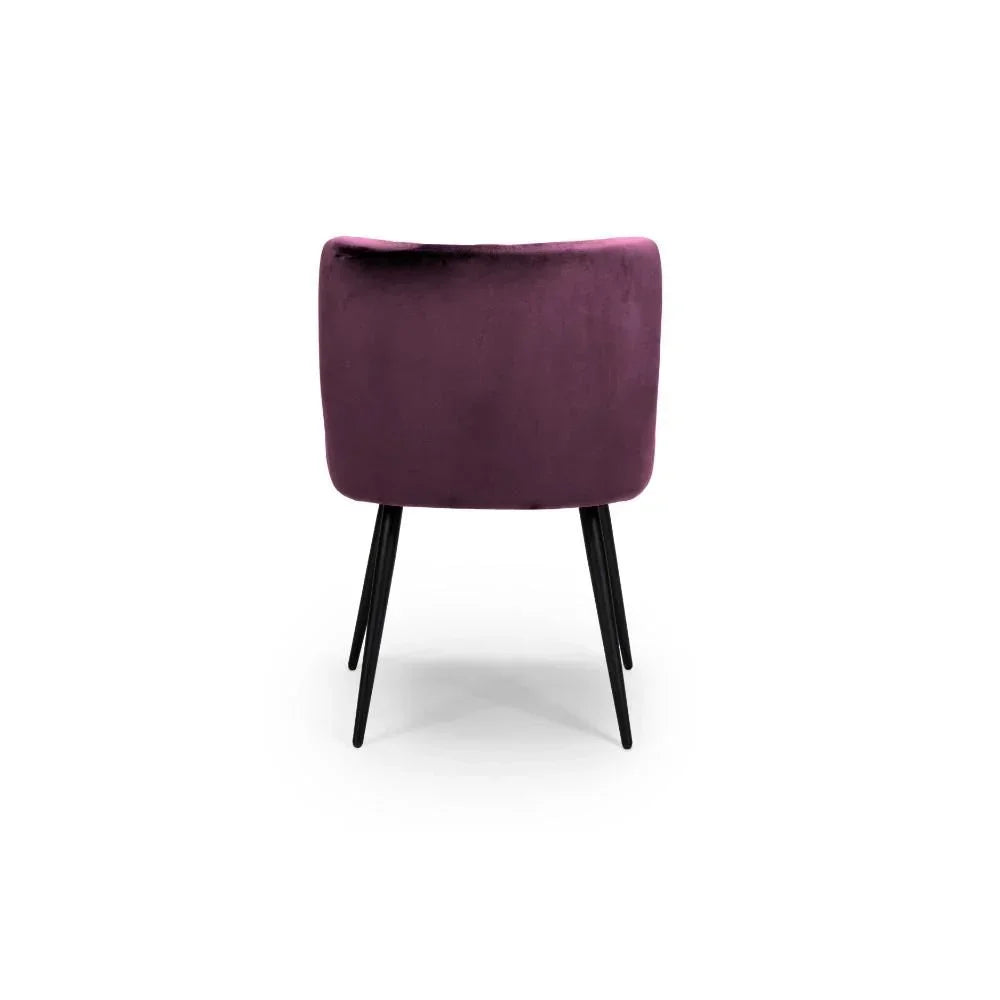 Rear view of purple velvet dining chair with black tapered metal legs