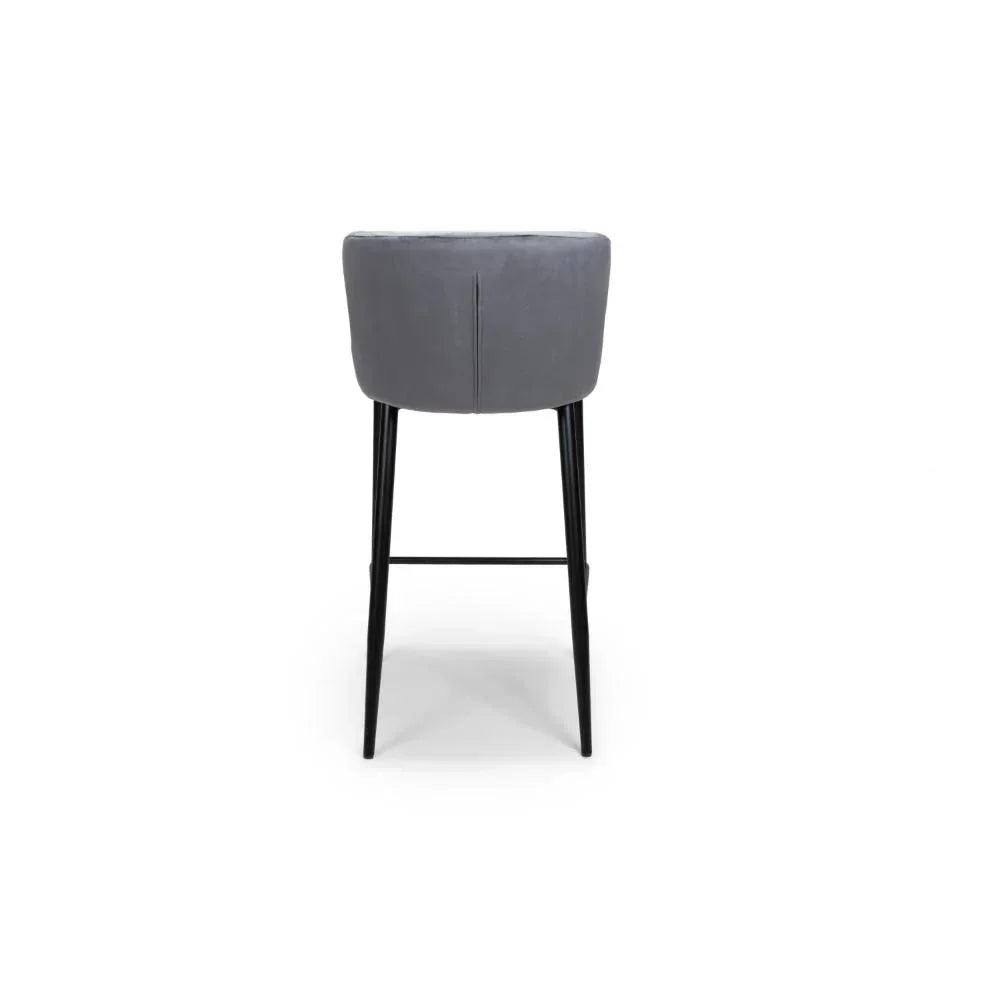 Grey velvet bar stool with black metal legs, rear view showing curved backrest