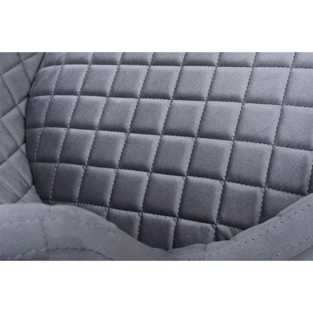 Close-up of grey quilted velvet dining chair upholstery