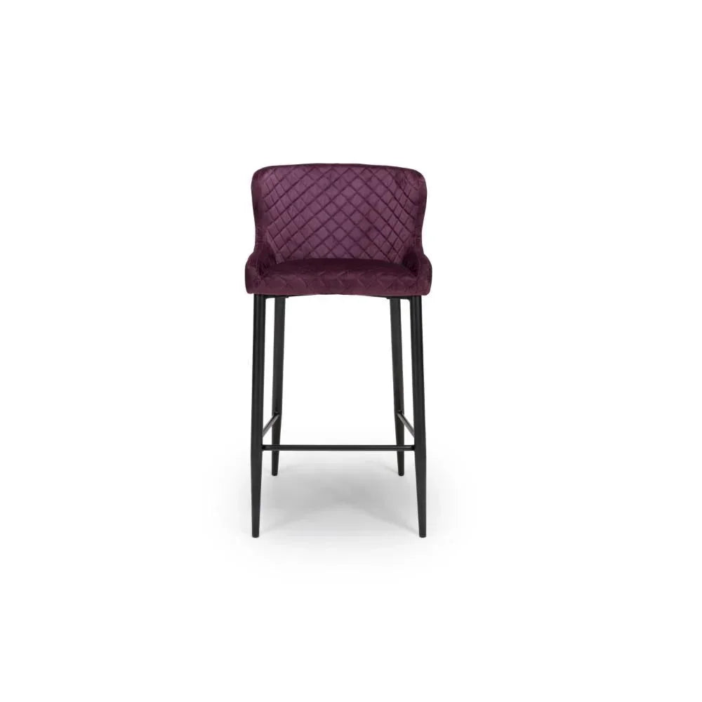 Plum velvet bar stool with quilted backrest and black metal legs, front view