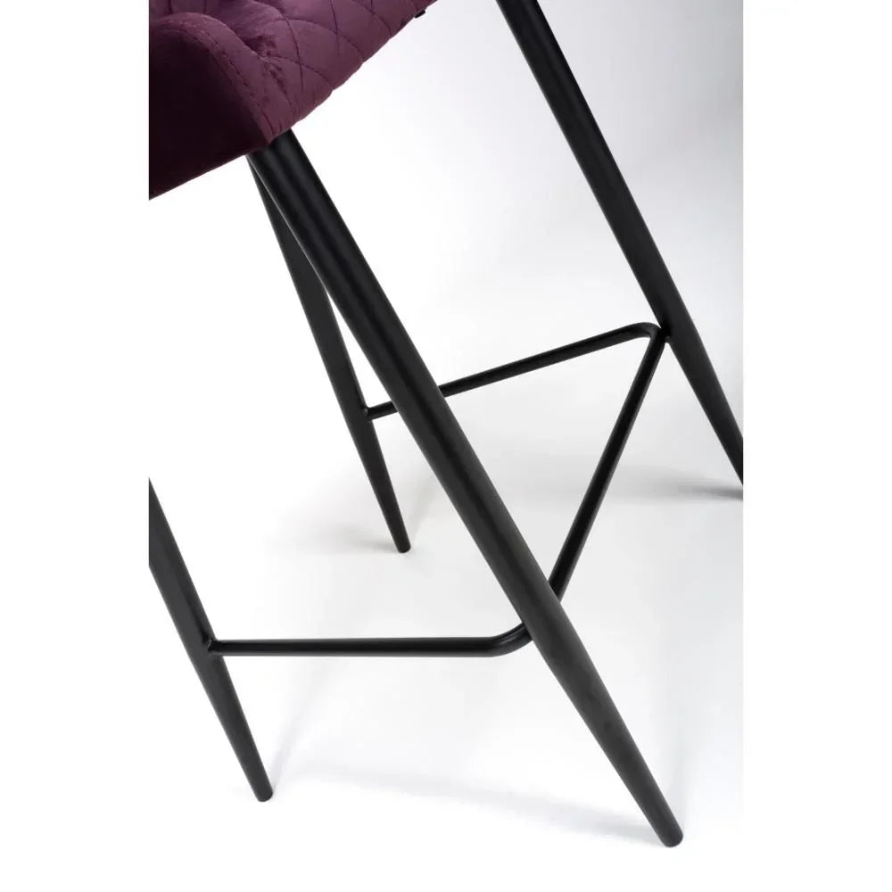 Black metal legs and footrest on purple upholstered bar stool