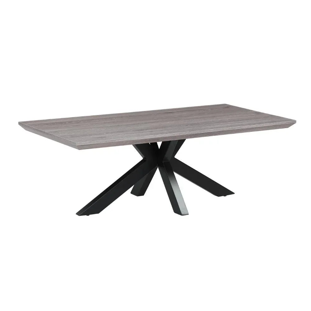 Rectangular dining table with grey wood top and black metal spider leg base