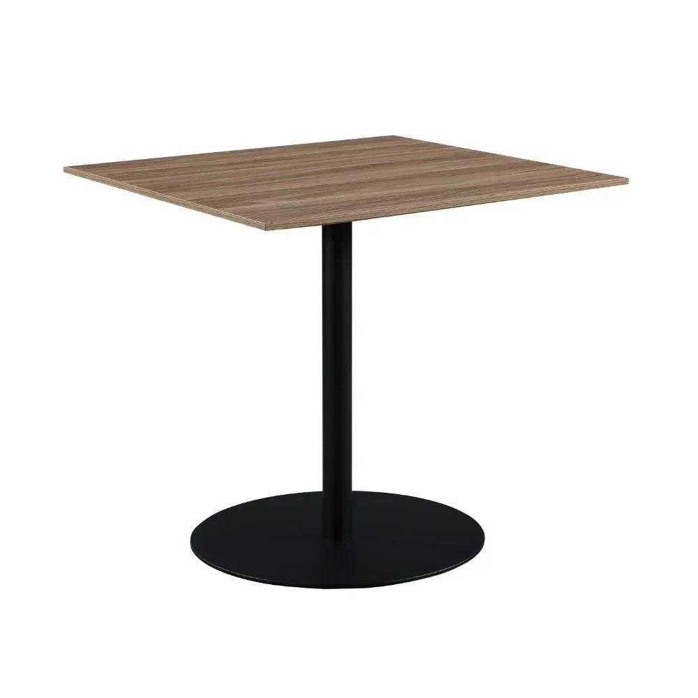 Square wooden dining table with black metal pedestal base on white background