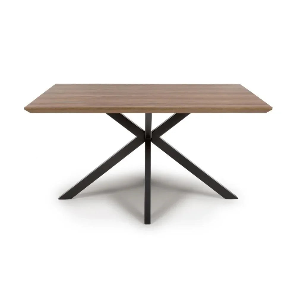 Rectangular dining table with wood top and black metal cross legs on white background
