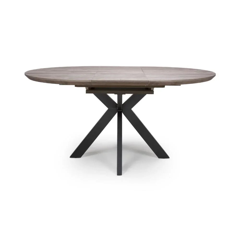 Round wooden dining table with cross black metal legs, front view