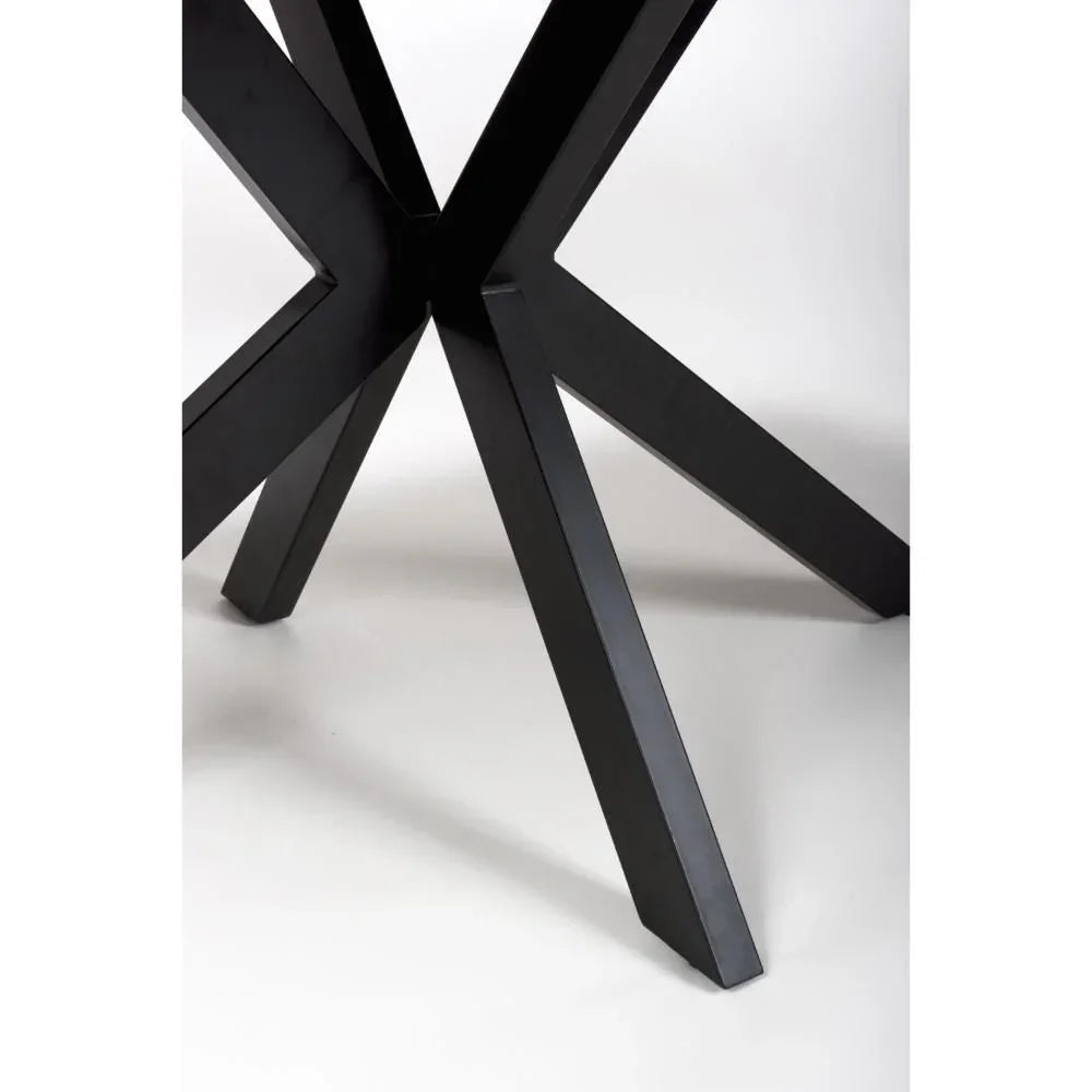 Black metal dining table legs in a modern cross design, angled close-up view
