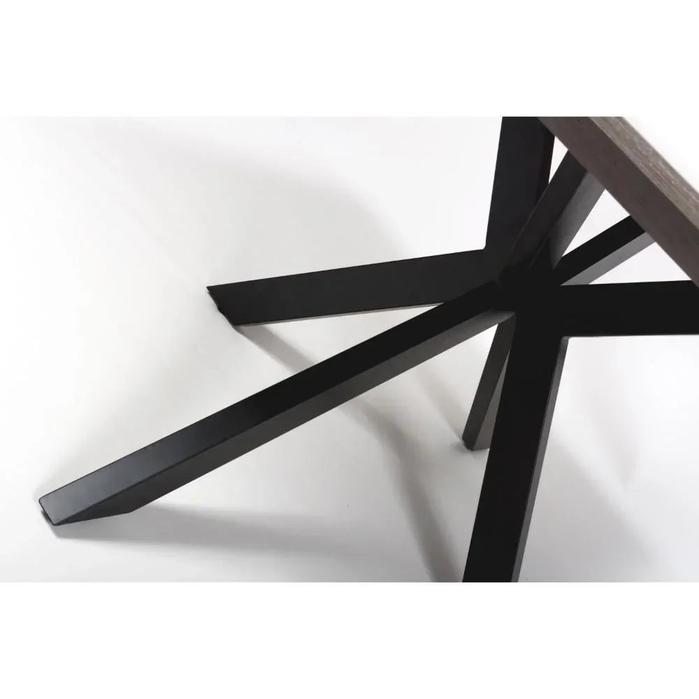 Black metal dining table legs with star-shaped base on white background