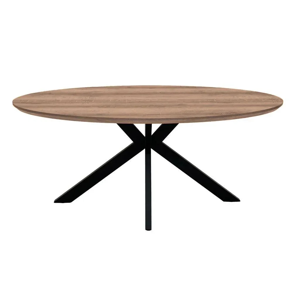 Round wooden dining table with natural finish and black crossed metal legs