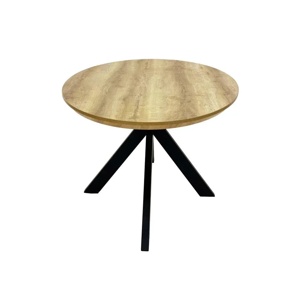 Round oak dining table with black metal legs on white background