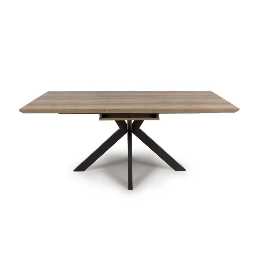 Rectangular wooden dining table with black cross metal legs, front angle view