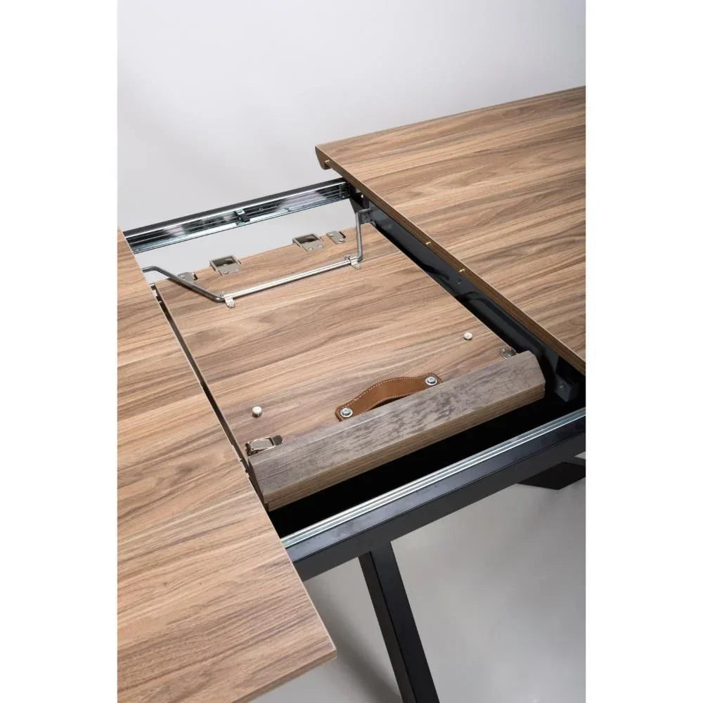 Walnut extending dining table with metal legs showing extension mechanism detail