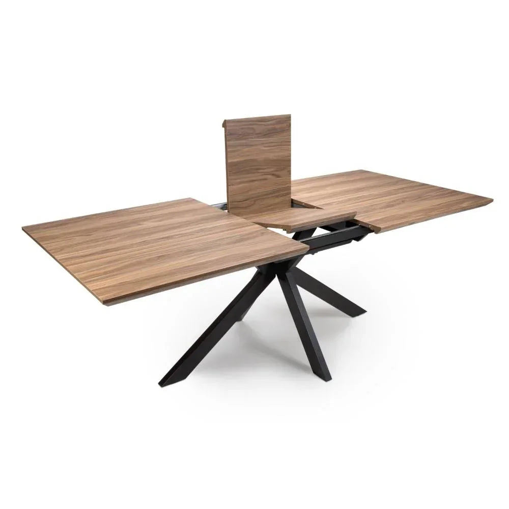 Walnut extendable dining table with black metal legs, shown with extension leaf partially open