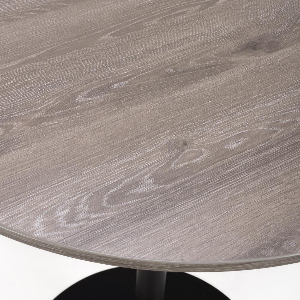 Round grey wood dining table top close-up showing grain and smooth finish