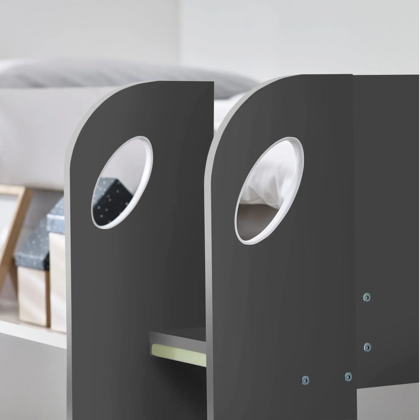 Charcoal and white underbed detail with circular cut-outs on Mars bunk bed