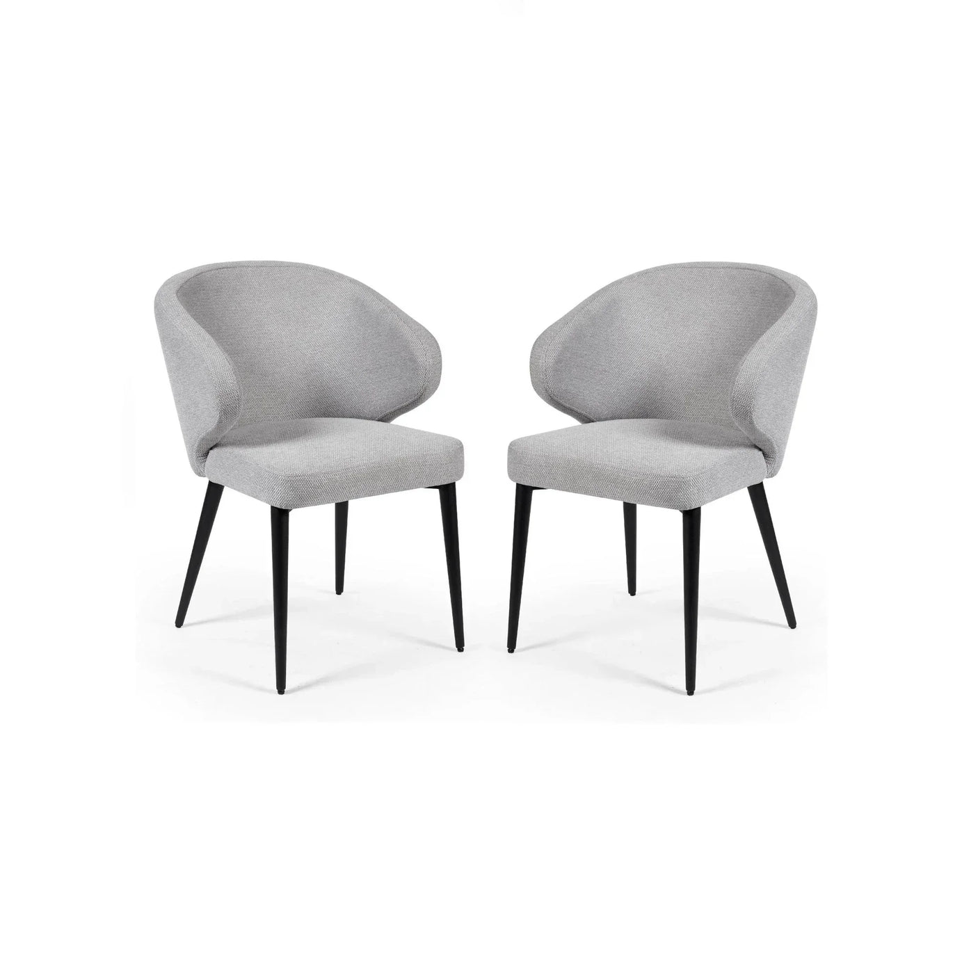 Pair of grey fabric dining chairs with curved backs and black tapered legs on white background