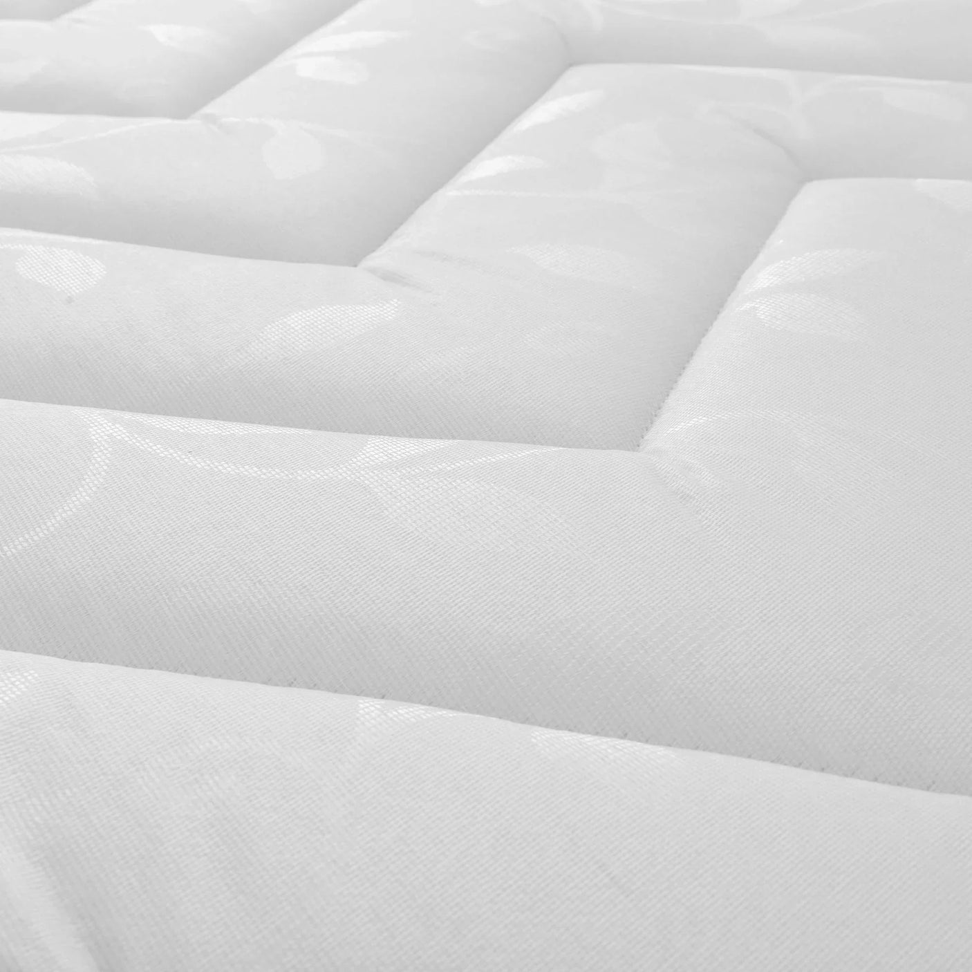 Close-up of deluxe semi-orthopaedic mattress white quilted fabric with stitched pattern