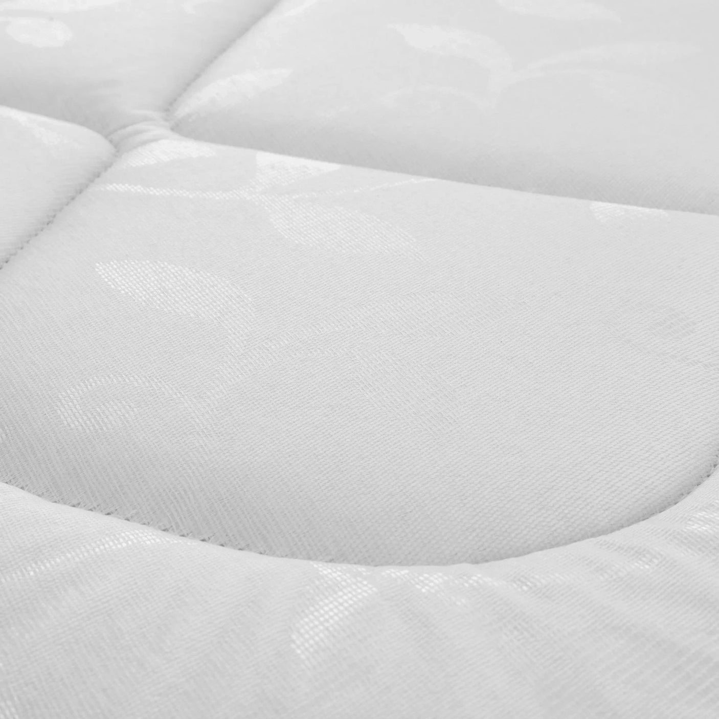 Close-up of Premier 90cm mattress fabric with quilted stitching and subtle leaf pattern